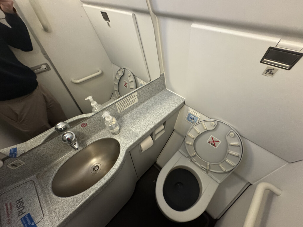 a bathroom with a sink and toilet