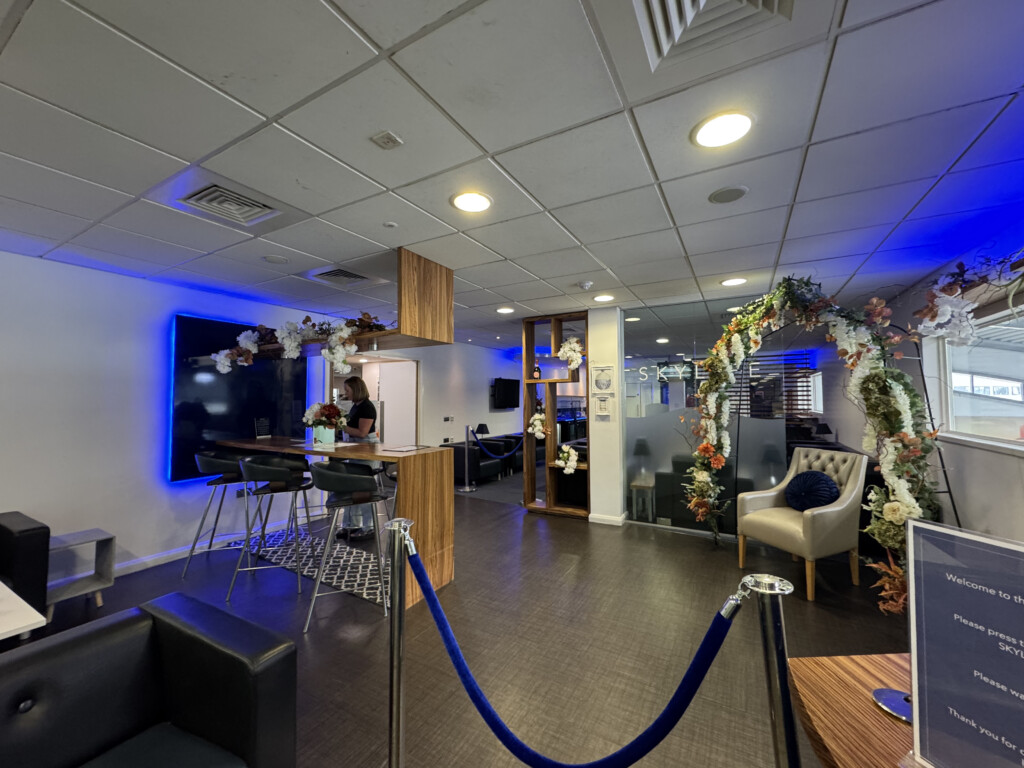 a room with a blue rope and a blue carpet