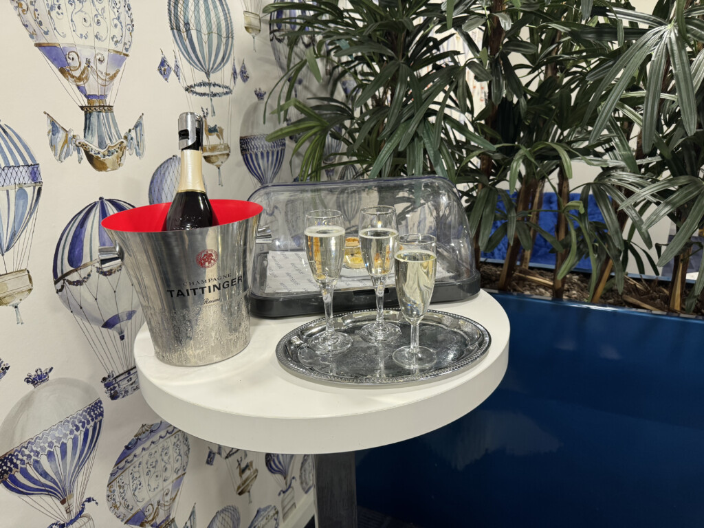 a table with a bottle of champagne and glasses on it
