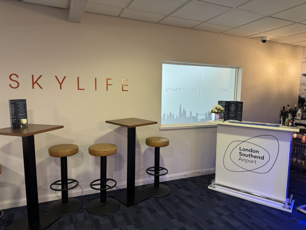 a room with stools and a white stand