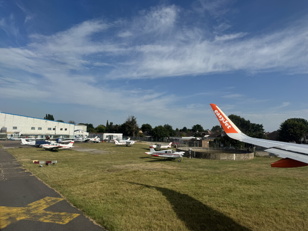 a group of airplanes on a field