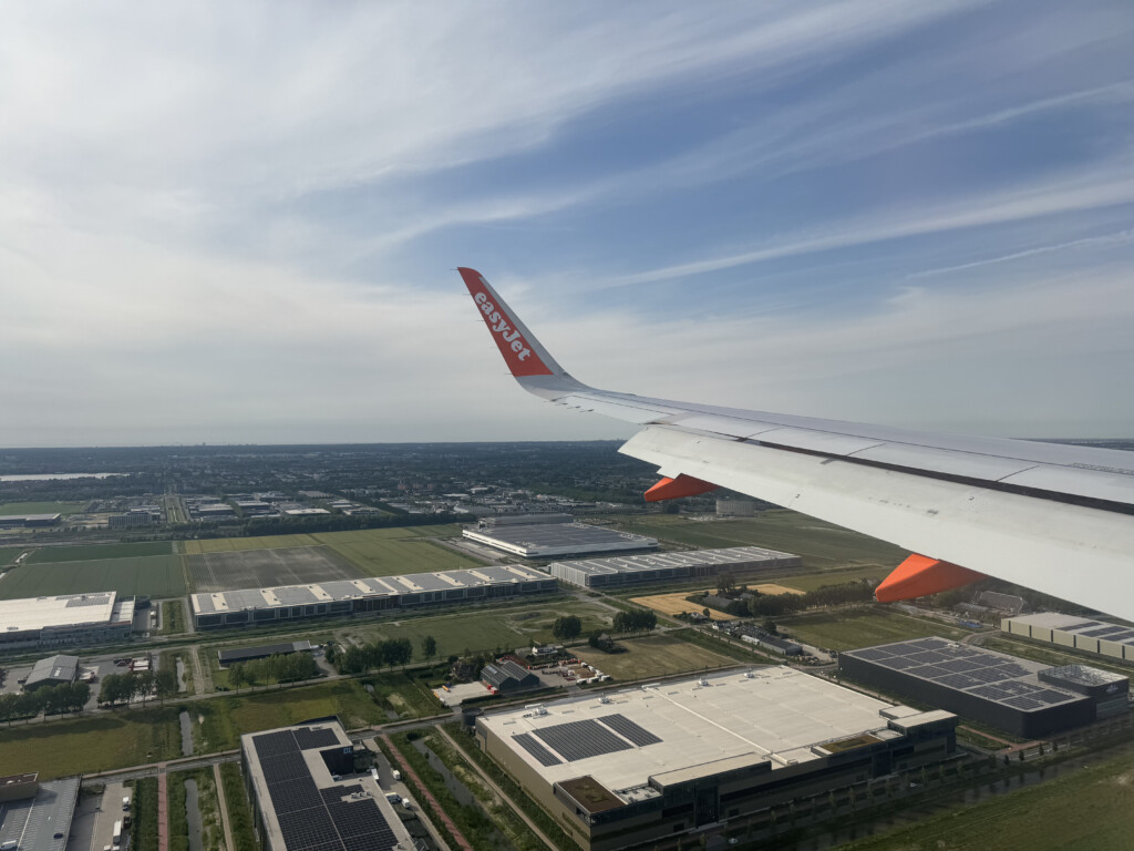 an airplane wing over a city