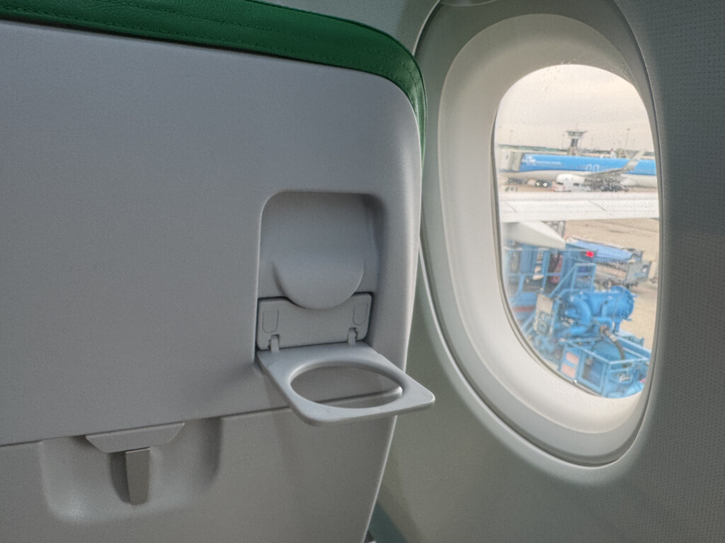 an airplane window with a seat open
