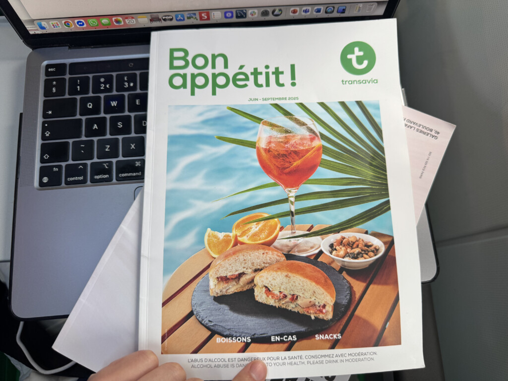a hand holding a magazine