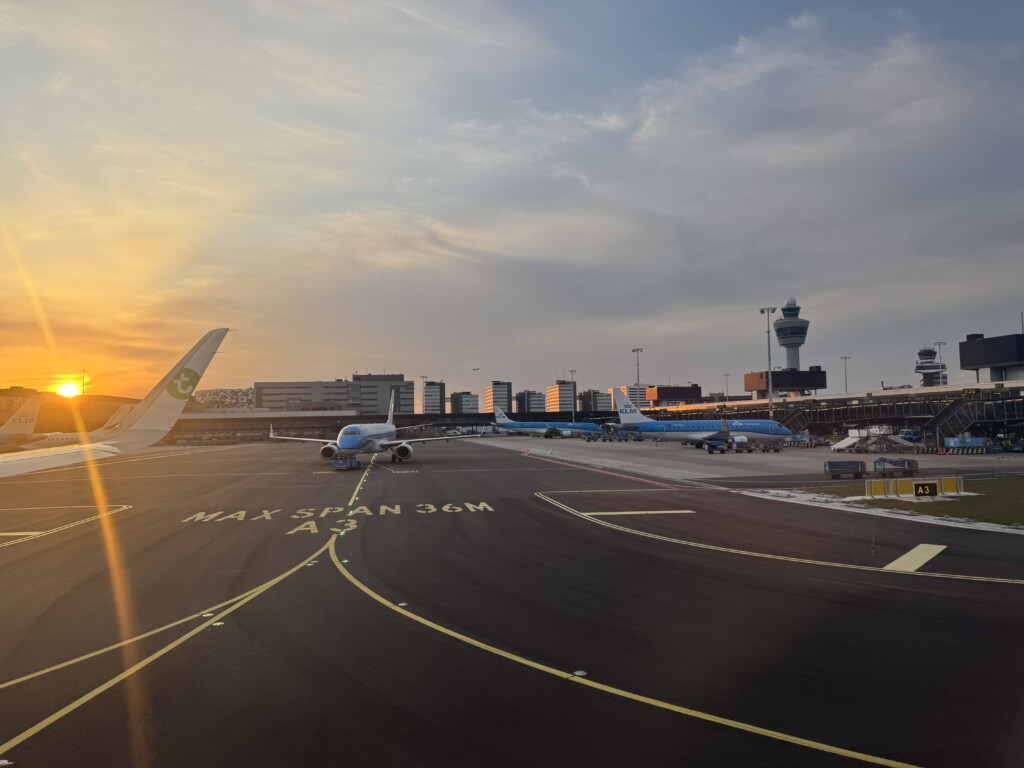 an airport with airplanes on the runway