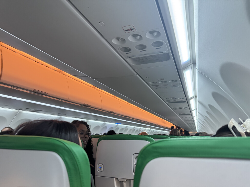 a group of people sitting on an airplane