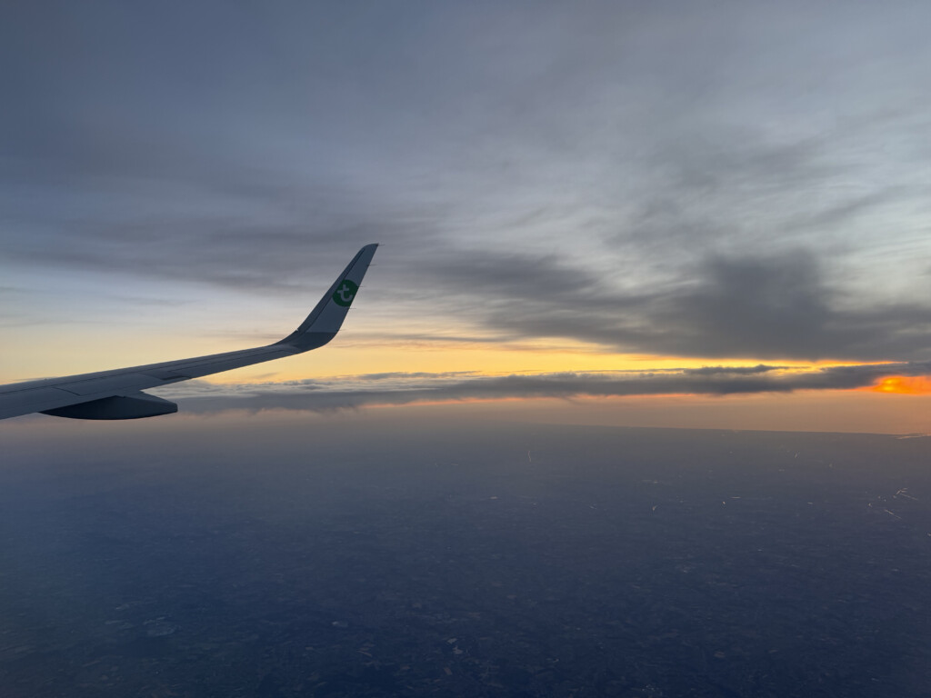 an airplane wing in the sky