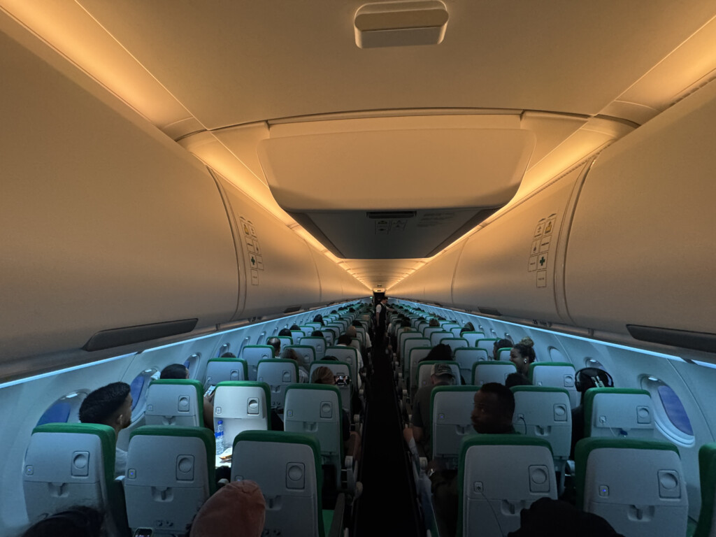 a plane with people sitting in the seats