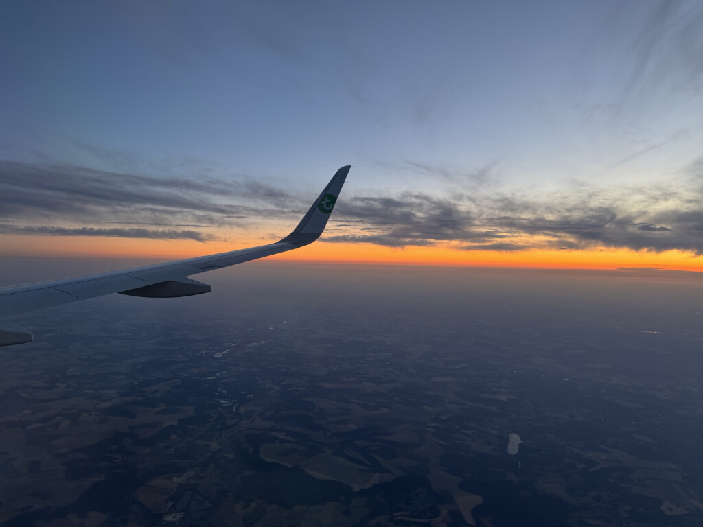 an airplane wing in the sky
