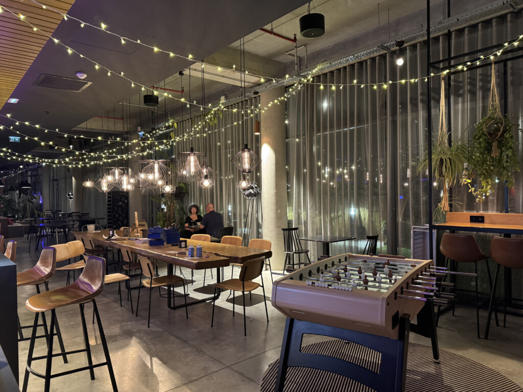 a room with tables and chairs and lights