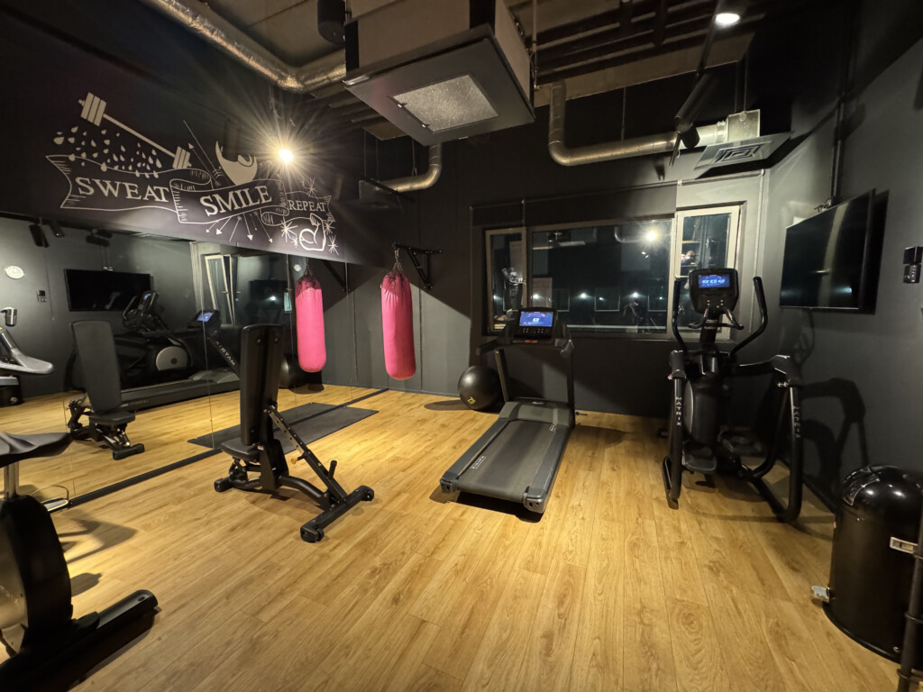 a room with treadmills and exercise equipment