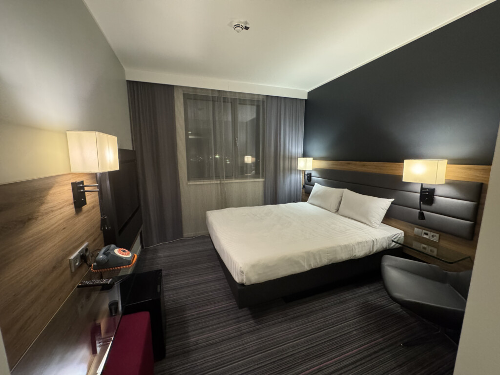 a room with a bed and a chair