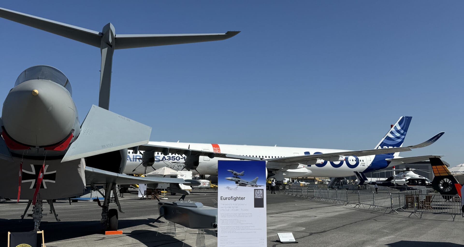 a group of airplanes on a runway