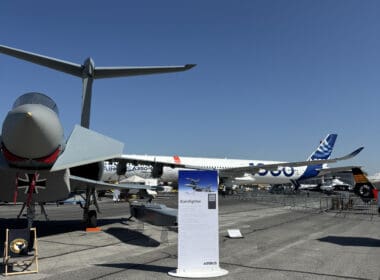 a group of airplanes on a runway