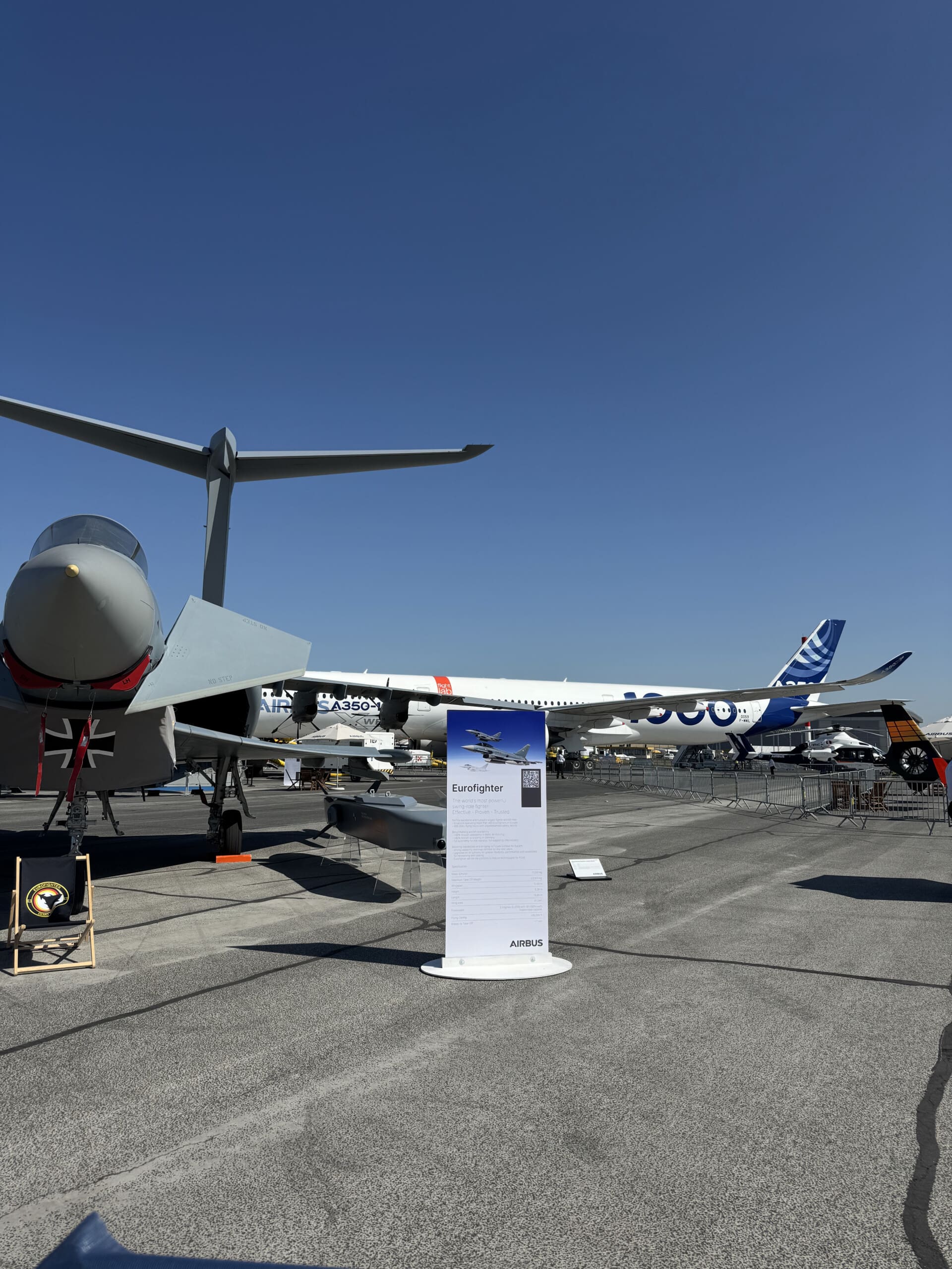a group of airplanes on a runway