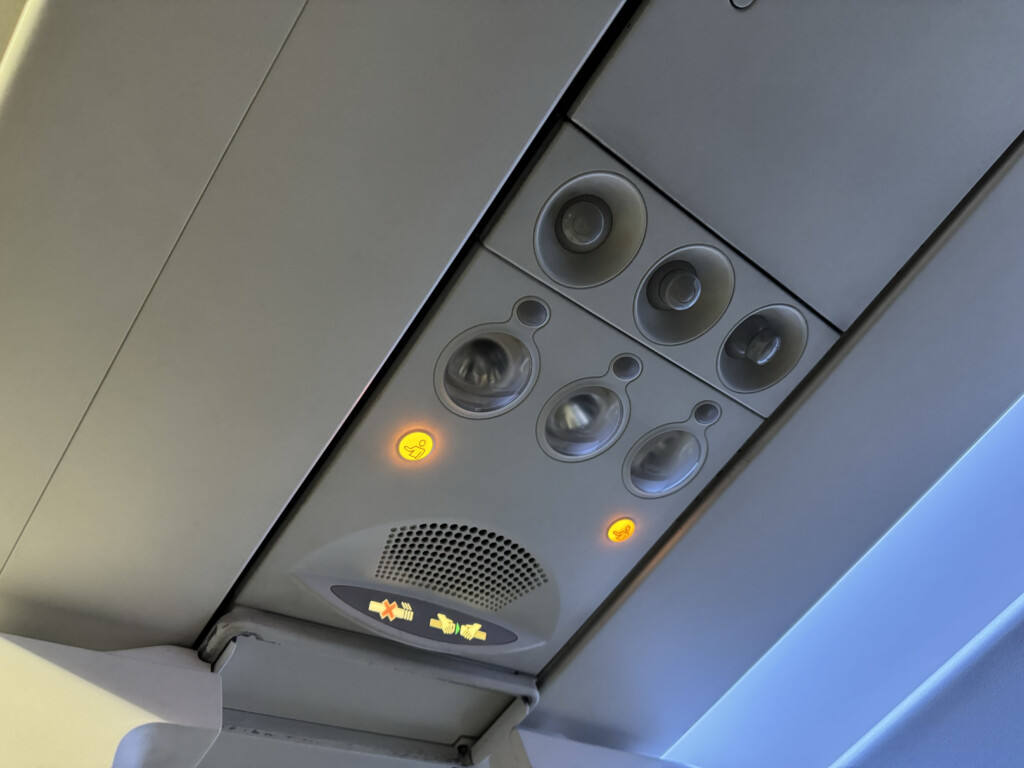 a overhead panel with lights and buttons