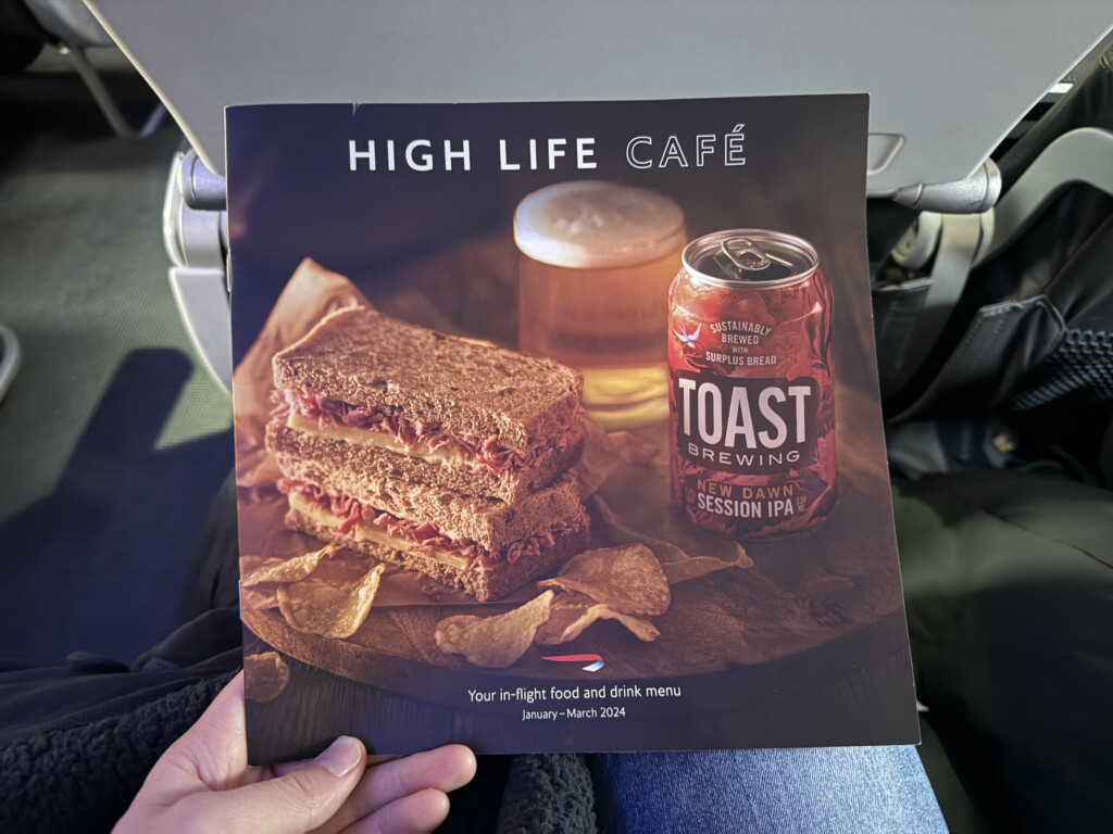 a hand holding a menu