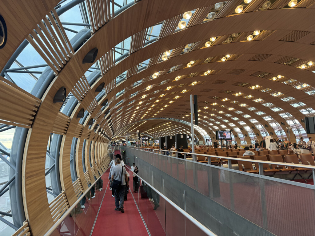 a large circular tunnel with people walking on it