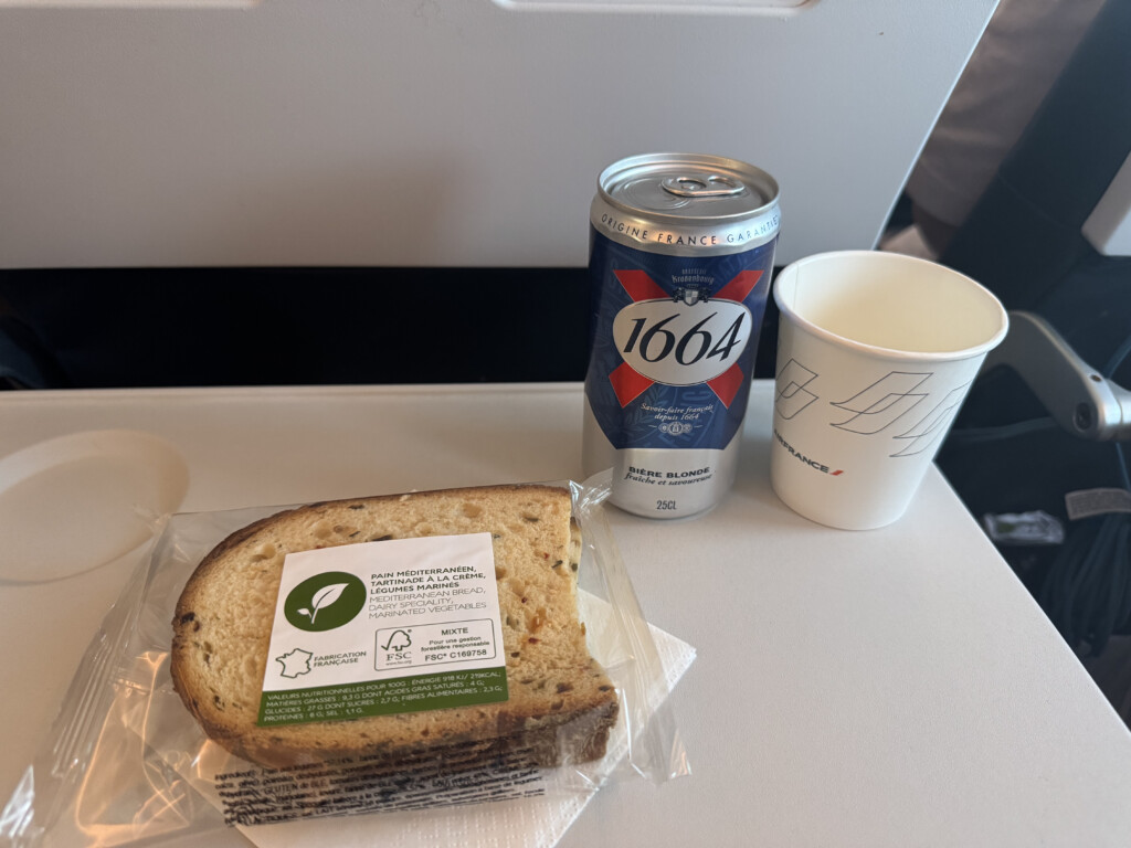 a sandwich and soda on a table