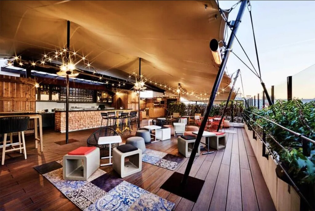 a patio with a table and chairs