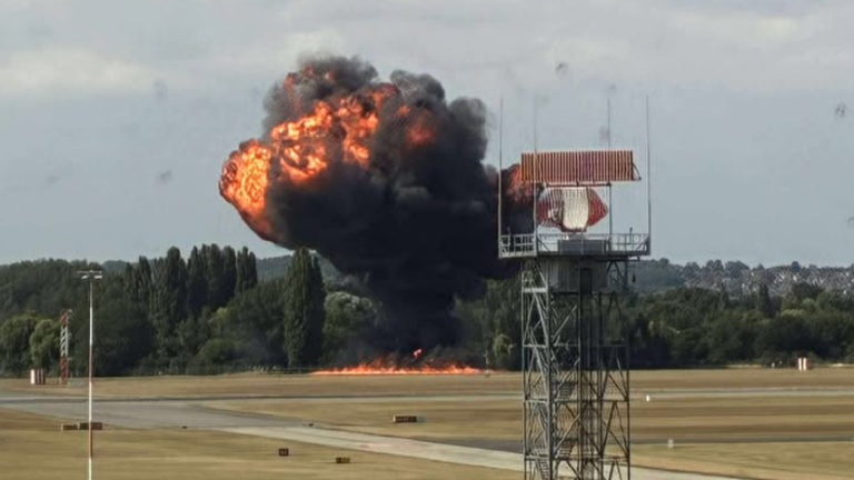 a large explosion on a runway