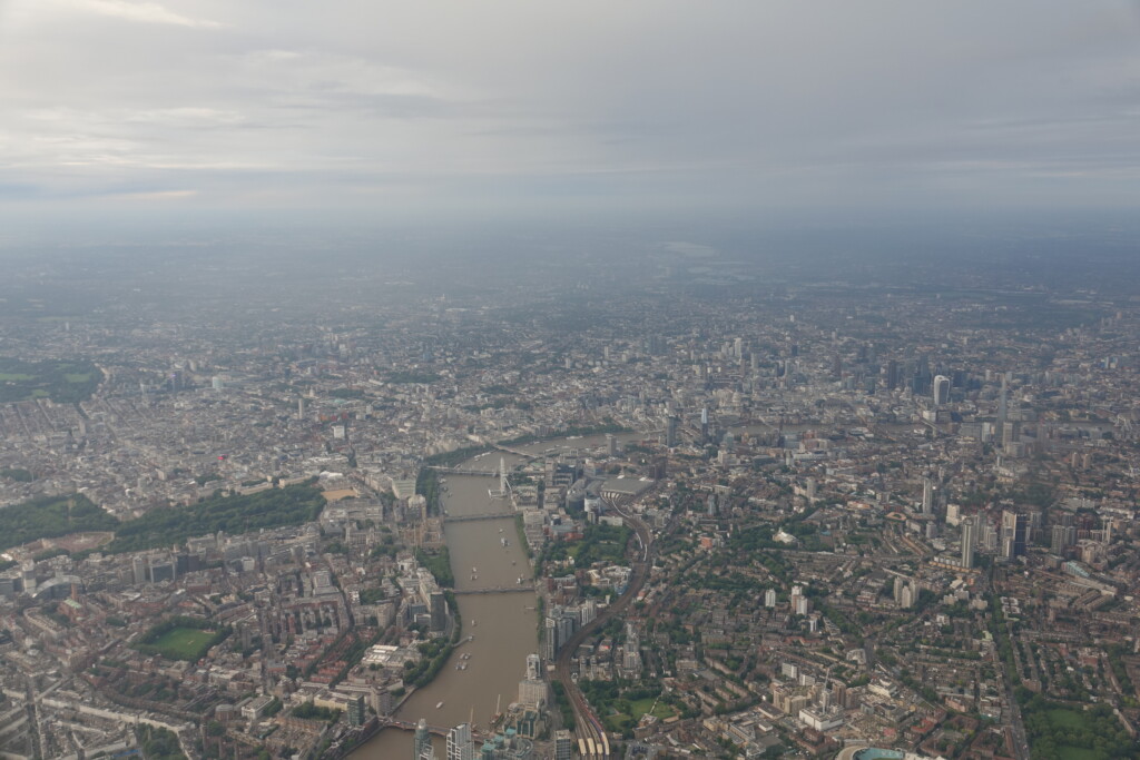 a city with a river and a city in the distance