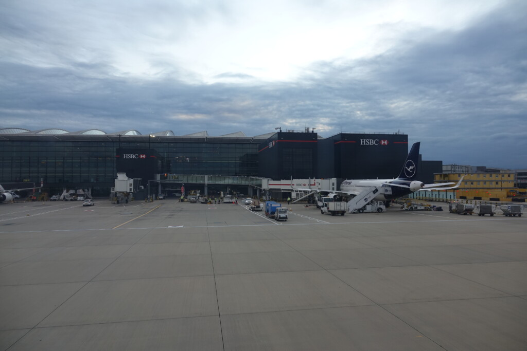 a plane parked in front of a building