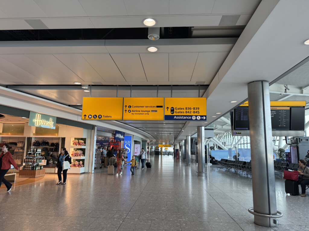 a large airport terminal with people walking