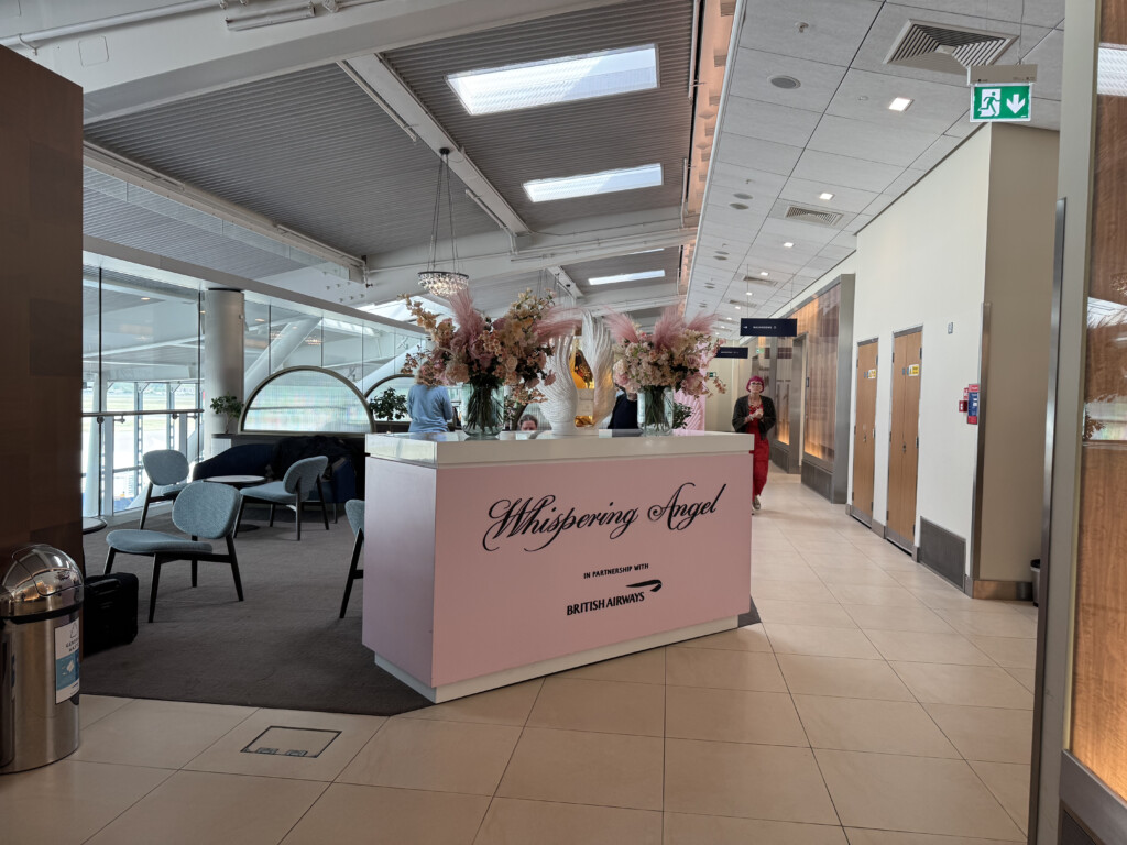 a pink reception desk in a building