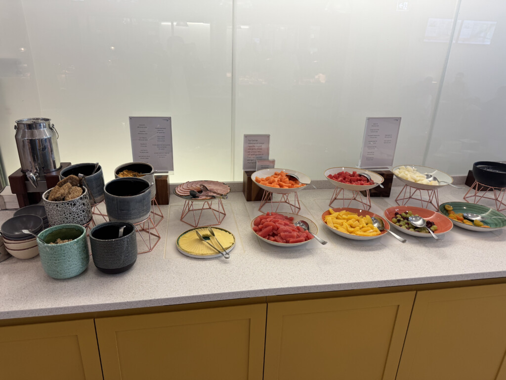 a buffet table with bowls of food