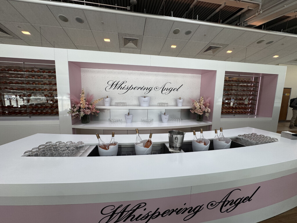 a white counter with pink and white objects in it