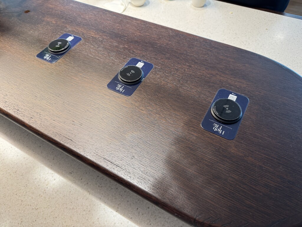 a table with circular black buttons on it