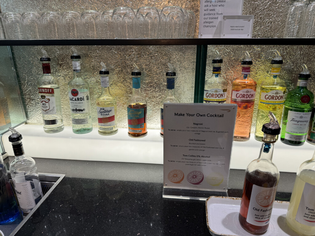a shelf with bottles of alcohol