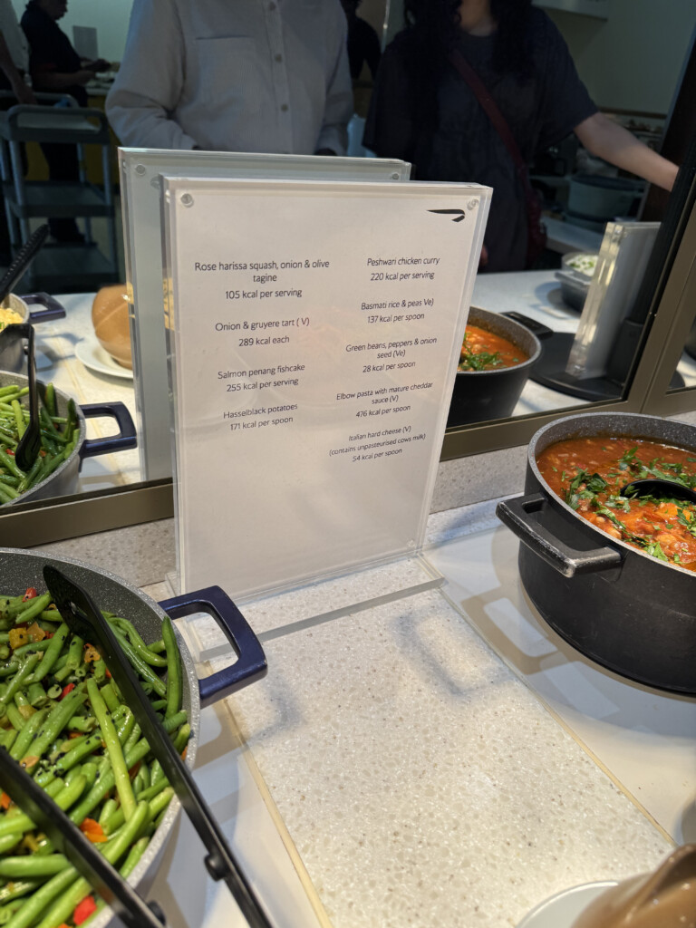 a menu on a table with food in pots