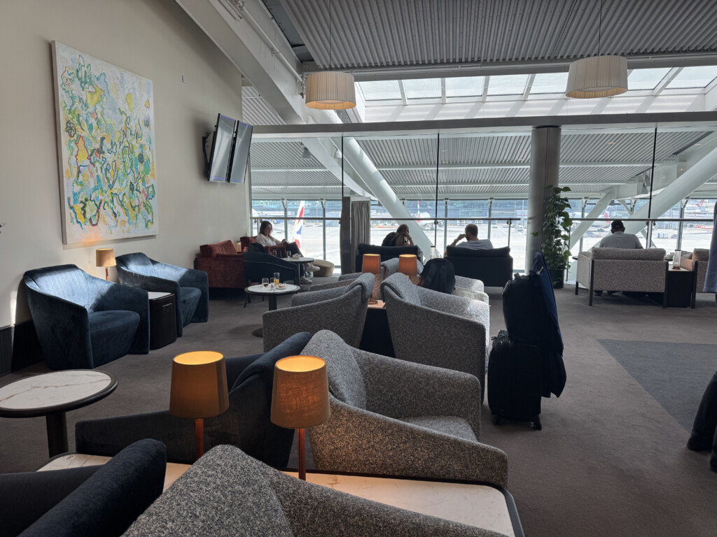 a room with chairs and a large window