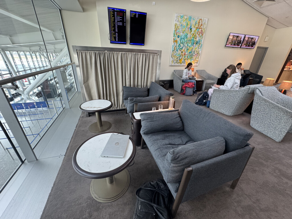 a group of people sitting in a lounge area