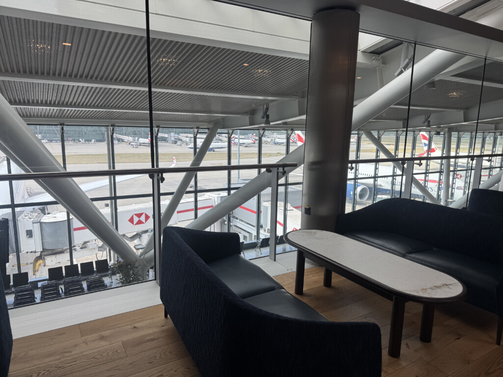 a couch and table in a room with windows
