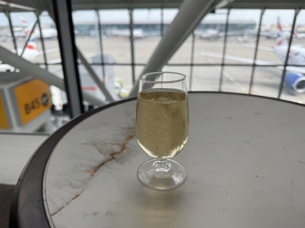 a glass of champagne on a table