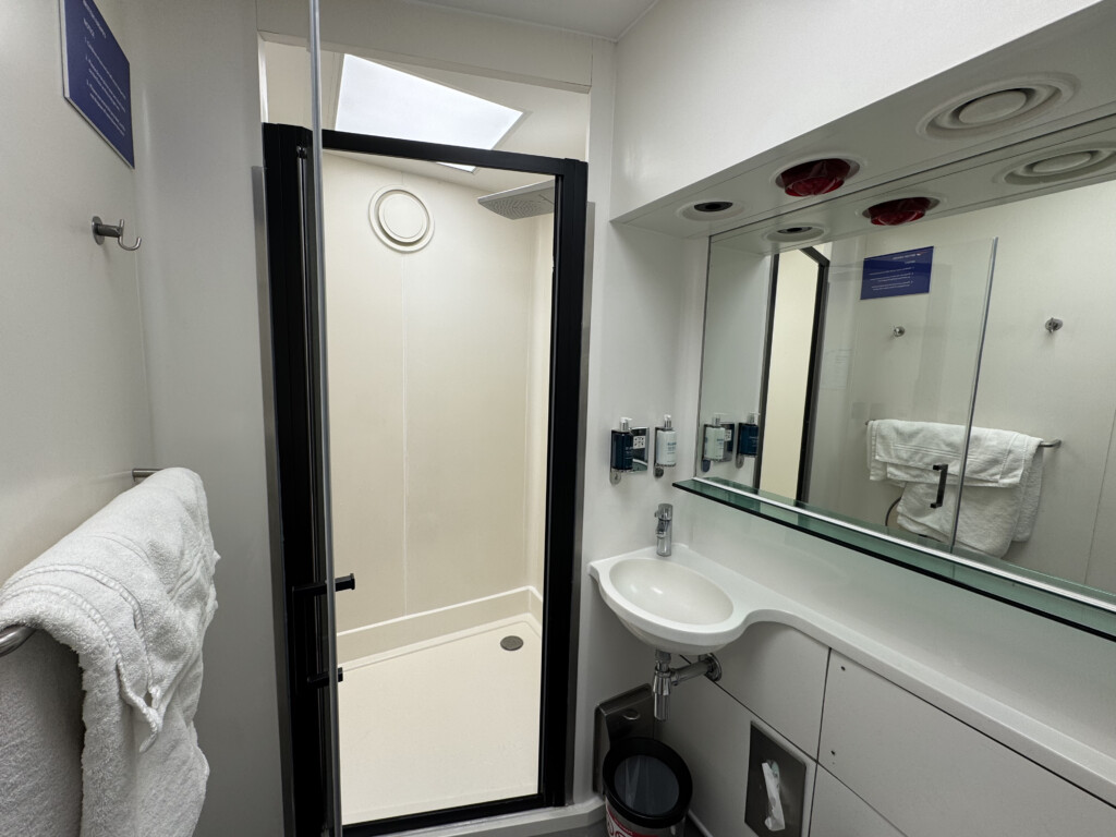 a bathroom with a shower and sink