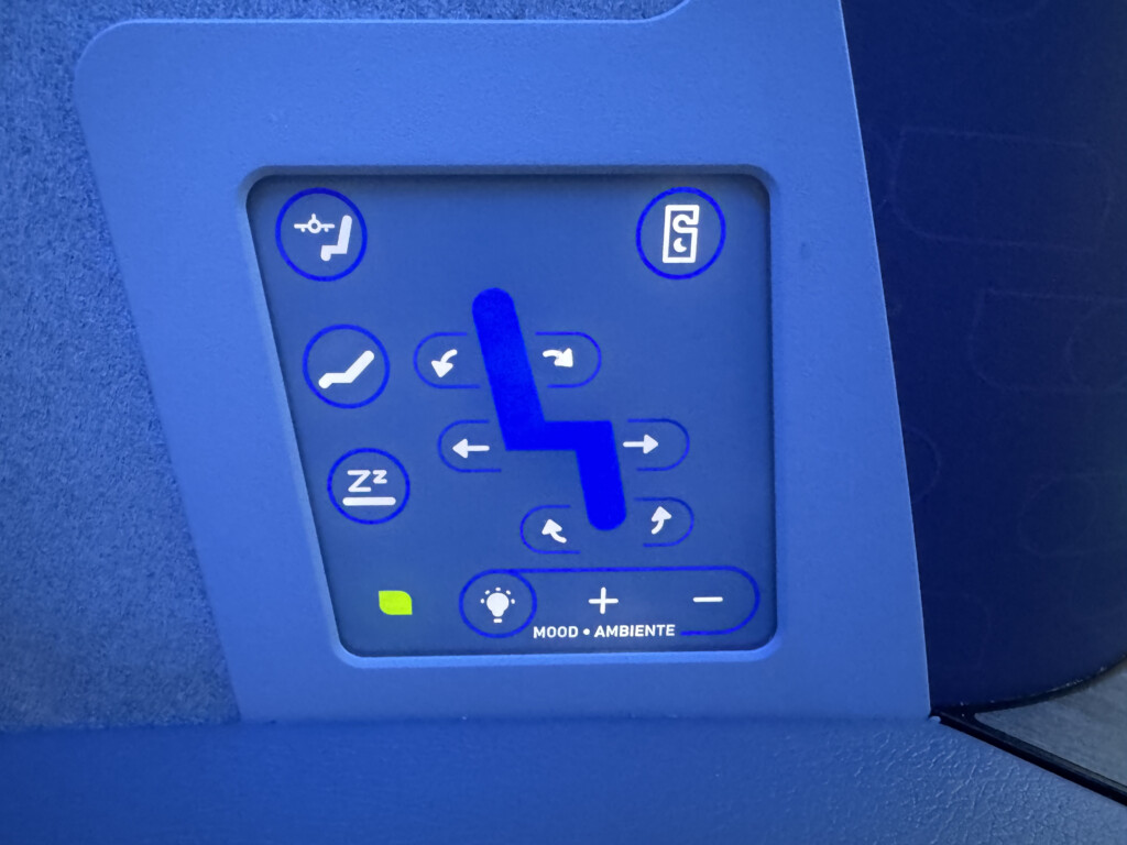 a blue screen with buttons and arrows