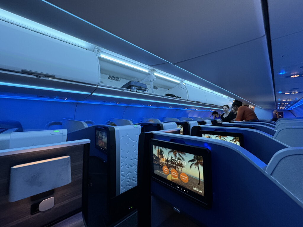 a group of people sitting in an airplane