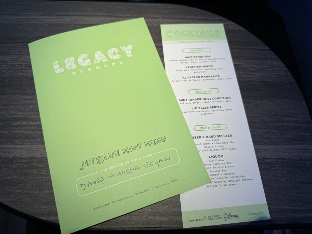 a green and white paper on a table