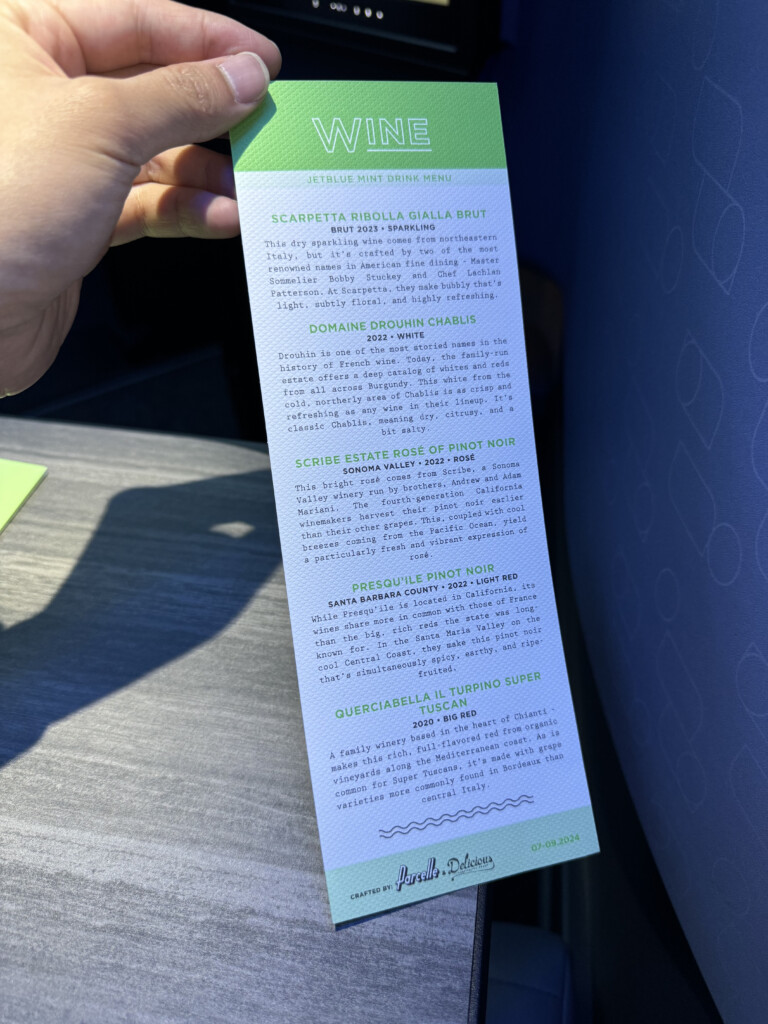 a hand holding a paper with text