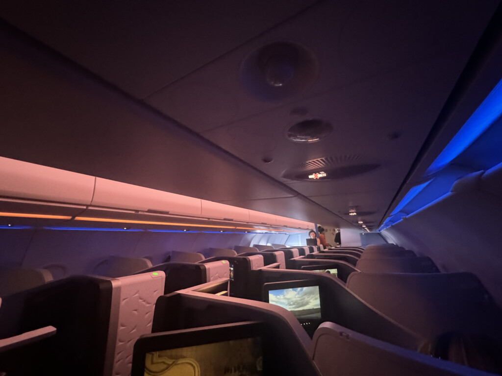 an airplane with seats and monitors