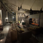 a room with a fireplace and lights