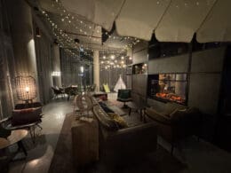 a room with a fireplace and lights