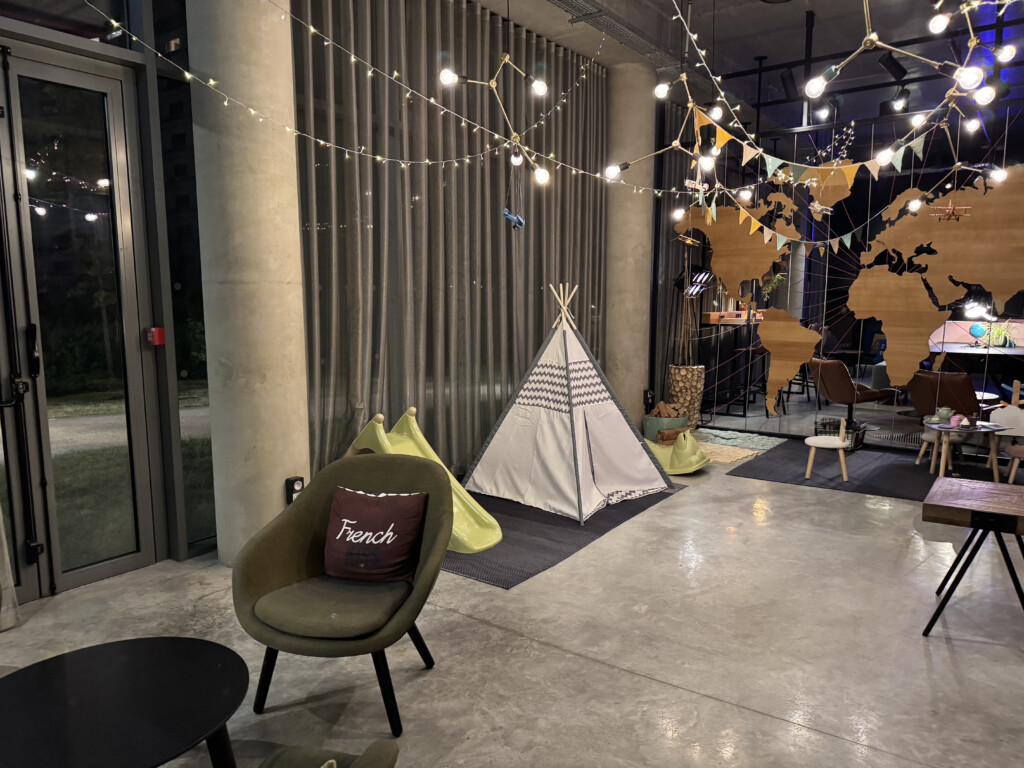 a room with a tent and a chair