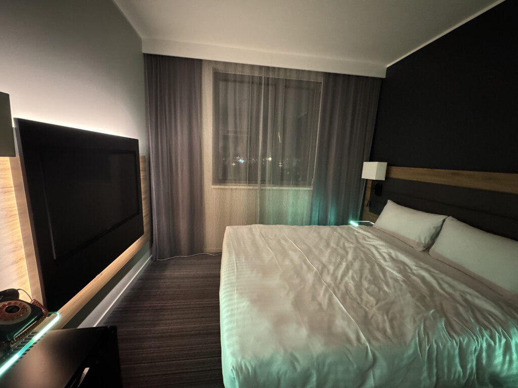 a bed with a tv in a room