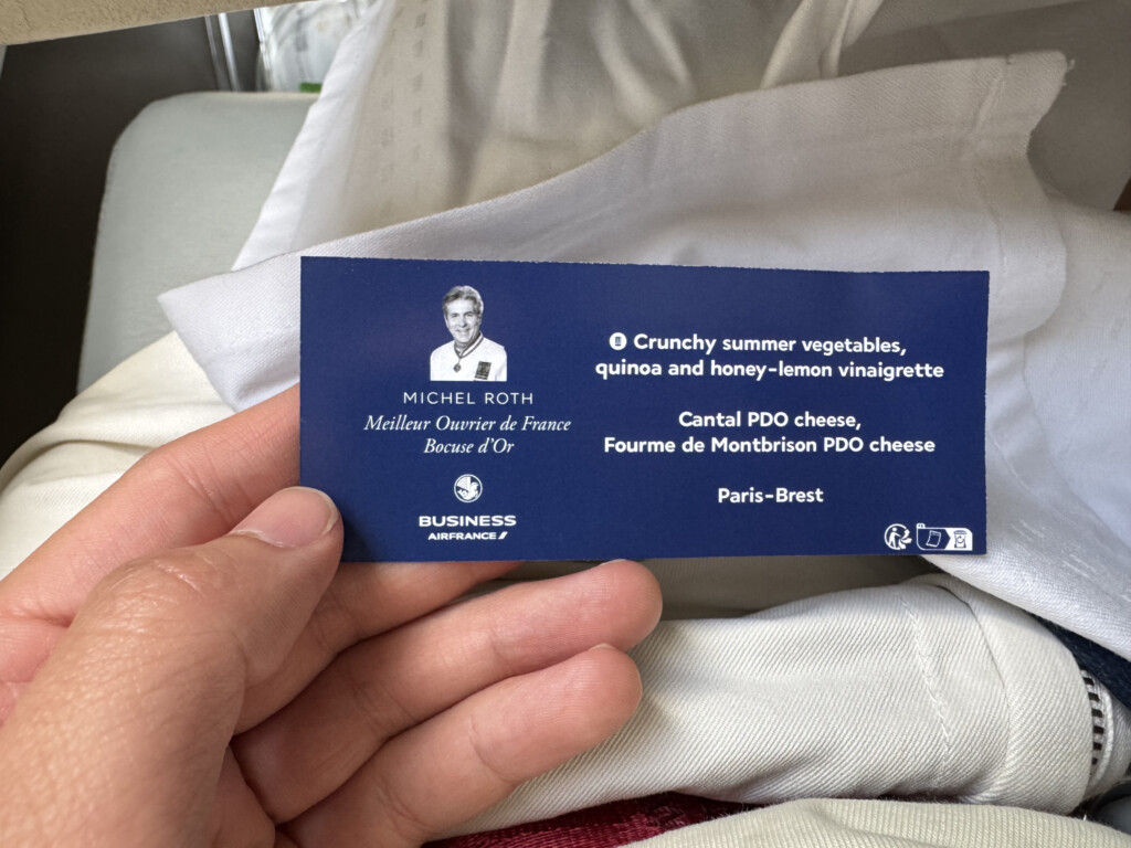 a hand holding a blue card