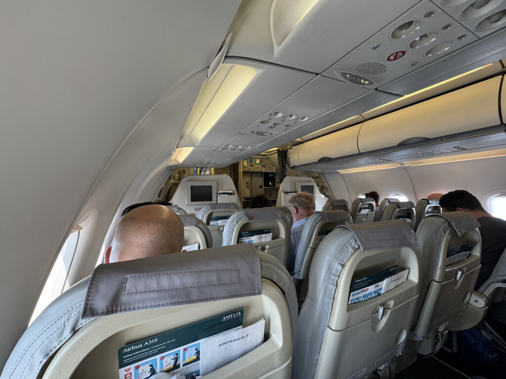 a group of people sitting in an airplane